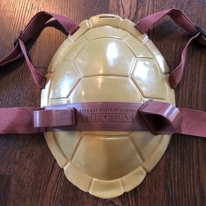 Two Teenage Mutant Ninja Turtle shells